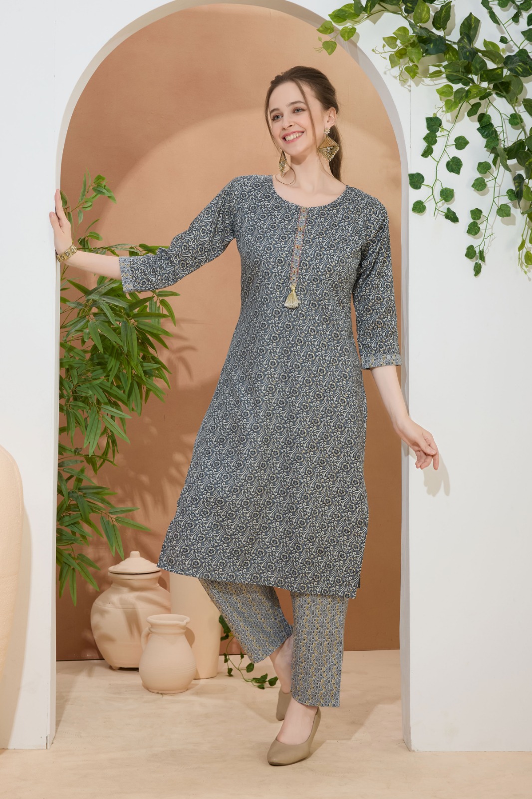 Everyday Gray Round Neck Kurti Pant Suit For Women. Embellished with Decorative Buttons and Thread Work.