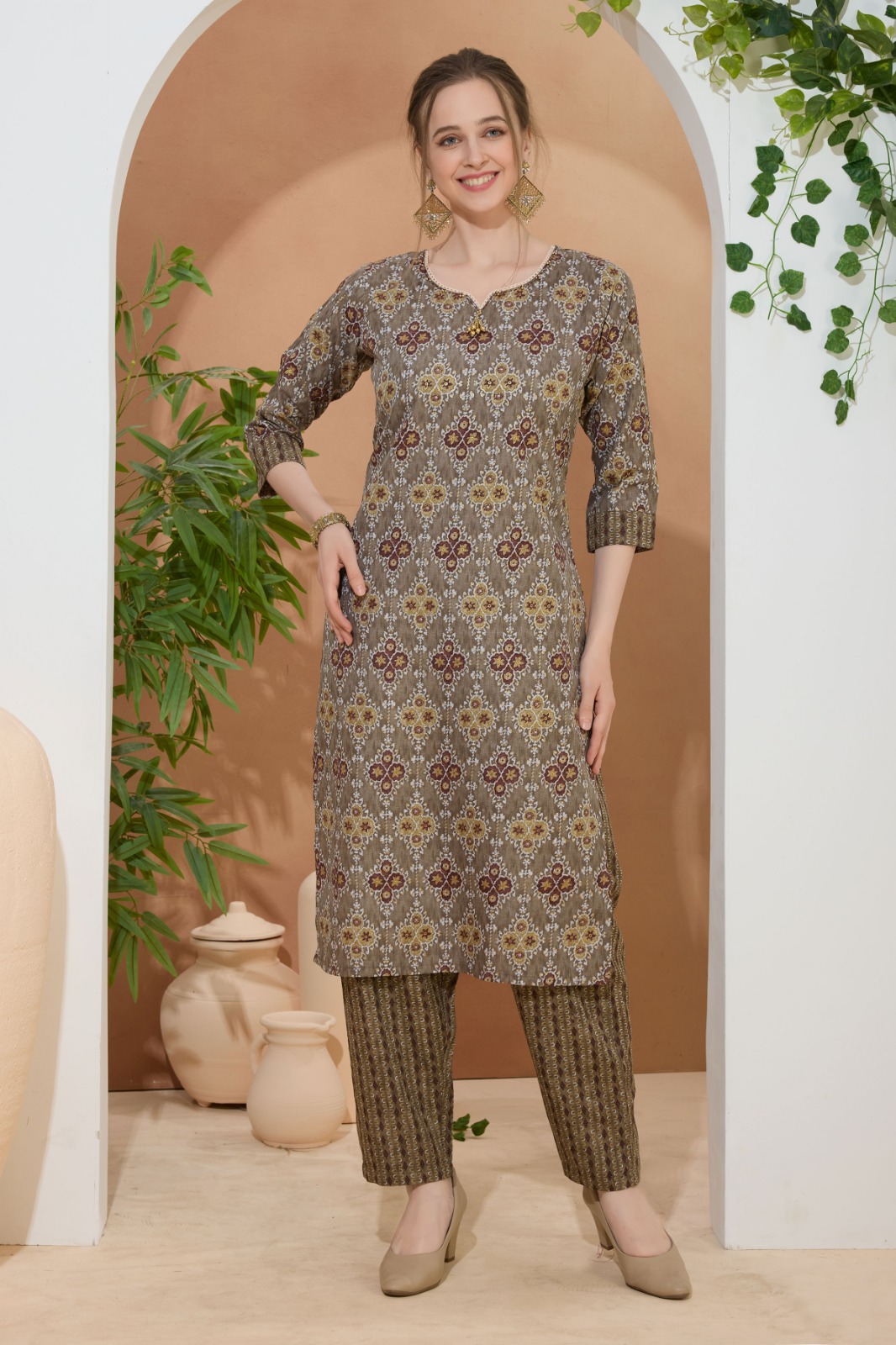 Golden Crown Brown Round Neck Kurti Pant Suit For Women. Embellished with Golden Beads and Thread Work.