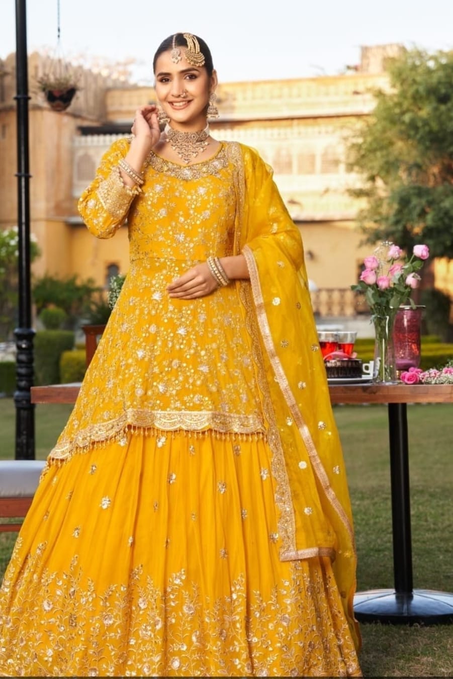 Probably georgette and organza over a silk .heavy floral thread  embroidery with zari and sequins