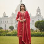 Red embroidered kurta set with a dupatta.