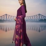 purple embroidered kurta  set with a multi-colored floral printed dupatta.