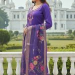 purple embroidered kurta set with trousers and a floral dupatta.